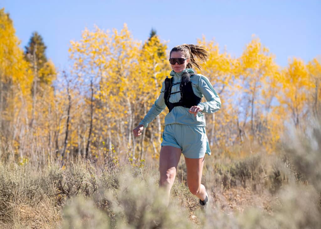 Woman running outside with light blue running apperal