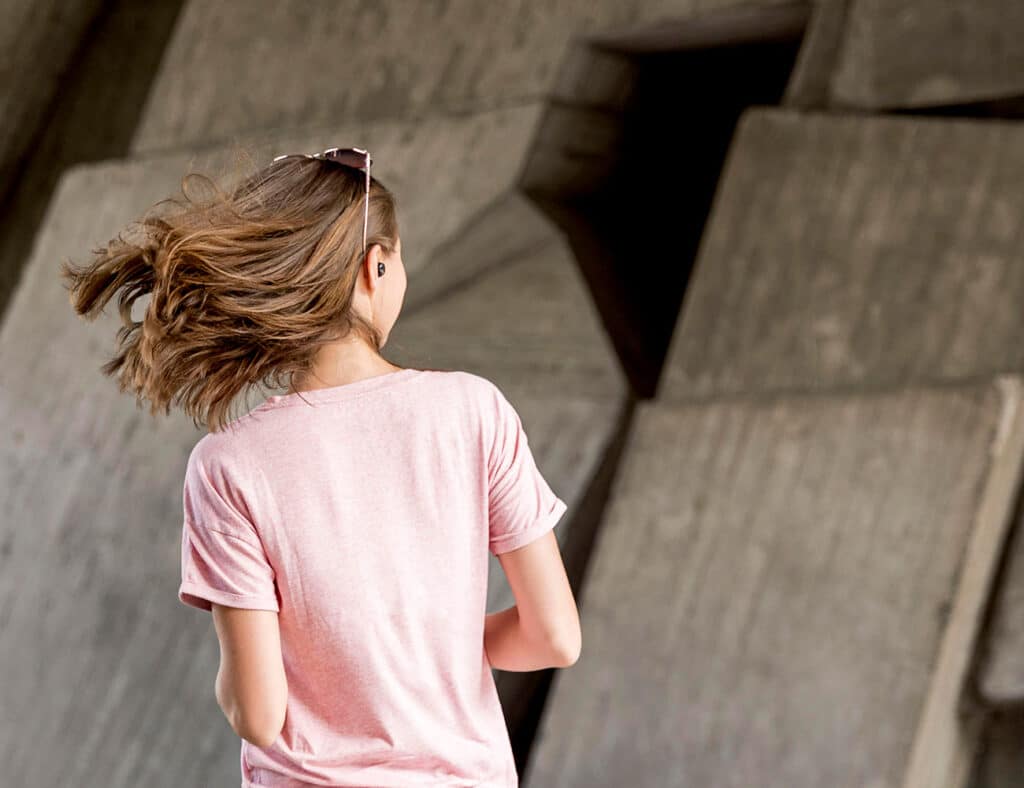 picture of a woman from behind wearing a cooling shirt for women
