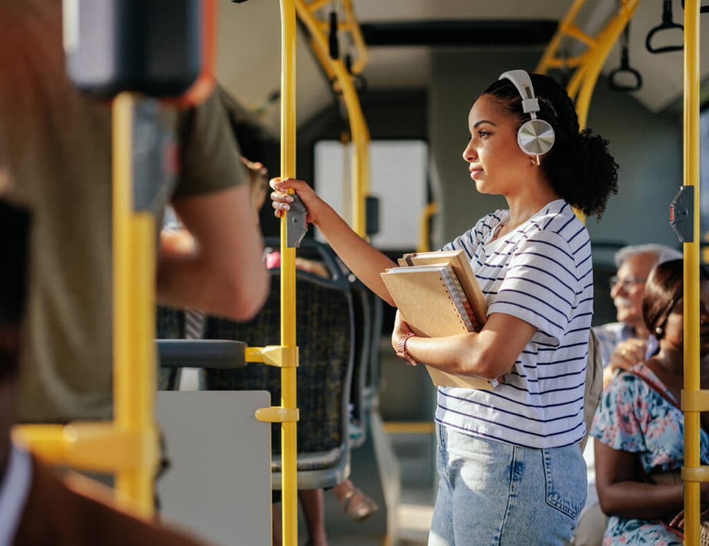 woman on bus in clothes that prevents sweating 