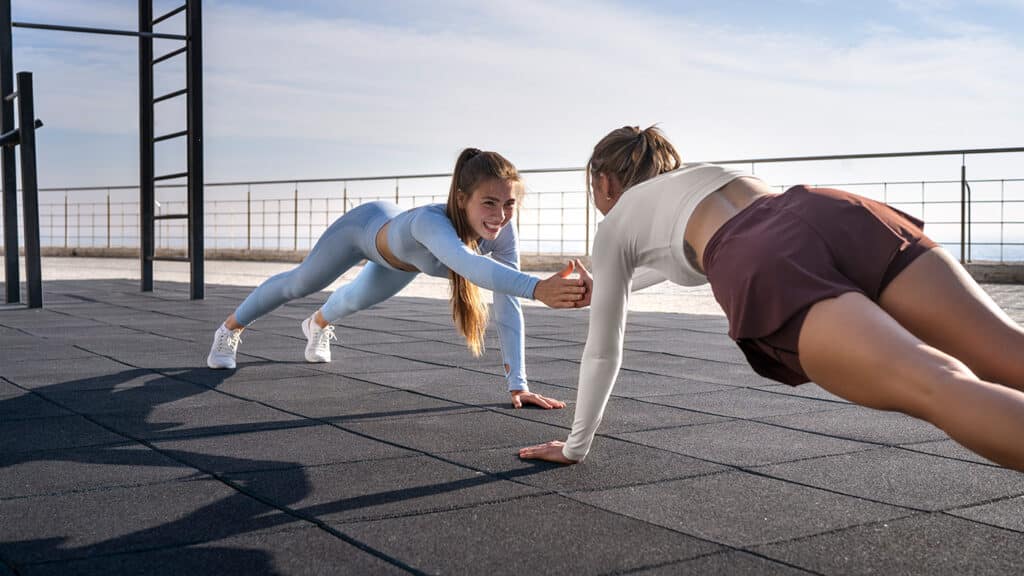two girls wearing moisture wicking workout shirts 